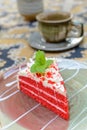 Red velvet cake with cup of tea and kettle Royalty Free Stock Photo