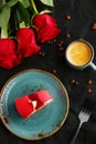 Red velvet cake on plate with cup of coffee and red rose on background top view Royalty Free Stock Photo