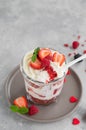 Red Velvet cake trifle with fresh berries in a glass jar on a gray concrete background. Dessert for Valentine`s Day. Copy space Royalty Free Stock Photo