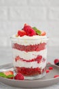 Red Velvet cake trifle with fresh berries in a glass jar on a gray concrete background. Dessert for Valentine`s Day. Copy space Royalty Free Stock Photo