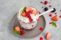 Red Velvet cake trifle with fresh berries in a glass jar on a gray concrete background. Dessert for Valentine`s Day. Copy space Royalty Free Stock Photo