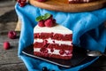 Red velvet cake on wood board. Slice of cake. Raspberry cake. Devil`s cake. Wedding dessert. Birthday cake. Delicious