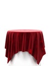 Red velvet cloth on a round pedestal isolated on white Royalty Free Stock Photo