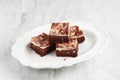 Red velvet cream cheese brownies on white dish Royalty Free Stock Photo