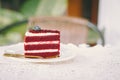 Red velvet cream layer cake closeup on the cafe table, desser food sweet delicious vintage tone