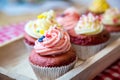 Red velvet cup cakes with white and rose topping Royalty Free Stock Photo