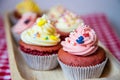 Red velvet cup cakes with white and rose topping Royalty Free Stock Photo