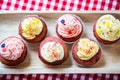 Red velvet cup cakes with white and rose topping Royalty Free Stock Photo