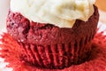 Red Velvet Cupcake with cream on wooden surface. Royalty Free Stock Photo