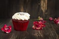 Red velvet cupcake over wooden background Royalty Free Stock Photo