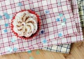 Red velvet cupcake on plaid cloth with decorative stars and a shallow depth of field