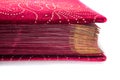 Red velvet with golden book pages isolated on white background Royalty Free Stock Photo