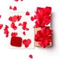 Red velvet jewelry box, and gift present with bow and paper cut heart lie on the notebook. love message. Valentine day. marriage Royalty Free Stock Photo
