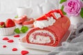 Red velvet rolled cake with fresh strawberries and cream cheese. Valentine`s Day dessert. Selective focus. Royalty Free Stock Photo