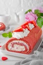 Red velvet rolled cake with fresh strawberries and cream cheese. Valentine\'s Day dessert. Selective focus Royalty Free Stock Photo