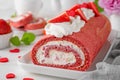 Red velvet rolled cake with fresh strawberries and cream cheese. Valentine\'s Day dessert. Selective focus Royalty Free Stock Photo