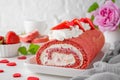 Red velvet rolled cake with fresh strawberries and cream cheese. Valentine\'s Day dessert. Selective focus Royalty Free Stock Photo