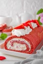 Red velvet rolled cake with fresh strawberries and cream cheese. Valentine\'s Day dessert. Selective focus Royalty Free Stock Photo