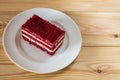 Red velvet slice of cake on white plate Royalty Free Stock Photo