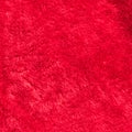 Red velvet texture background soft fluffy fur part of Christmas Santa Claus fashion clothing costume and hat accessory Royalty Free Stock Photo