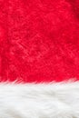 Red velvet texture background and white soft fluffy fur part of Christmas Santa Claus fashion clothing costume Royalty Free Stock Photo