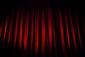 A red velvet theater curtain before the show begins.