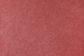 Red velveteen upholstery fabric texture background. Royalty Free Stock Photo