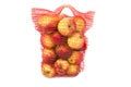 Red vertical standing string bag of apples