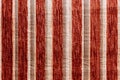 Red striped synthetic woven upholstery fabric close-up texture and background Royalty Free Stock Photo