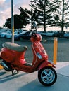 Red Vespa Beach town trees at sunset