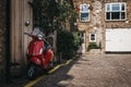 Red Vespa motorbike parked by a house in Dunworth Mews, Notting Royalty Free Stock Photo