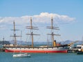 Red vessel ship parked at the pier