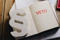 Red veto stamp in notepad