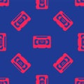 Red VHS video cassette tape icon isolated seamless pattern on blue background. Vector Royalty Free Stock Photo