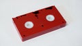 Red vhs video cassette on white background, back side Royalty Free Stock Photo