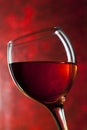 Red vine in glass on vintage background Royalty Free Stock Photo