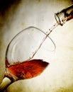 Red vine in glass on vintage background Royalty Free Stock Photo