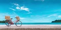 Red vintage bicycle on white sand beach over blue sea and clear blue sky background, spring or summer holiday vacation concept Royalty Free Stock Photo