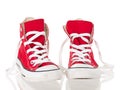 Red vintage canvas sneakers untied Royalty Free Stock Photo