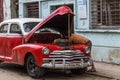 Red vintage car being worked on Royalty Free Stock Photo