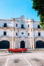 Red vintage car parked in Old Havana, Cuba Royalty Free Stock Photo
