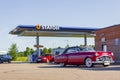 Red vintage car parked at Statoil gas station in Sweden Royalty Free Stock Photo