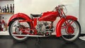 Red vintage classic 1935 Moto Guzzi 250 cc racing motorcycle in a cafe in Gravedona on Lake Como.