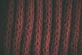 Red vintage knitted fabric texture and background for designers. Vintage knitted background. Close up view of red abstract texture Royalty Free Stock Photo