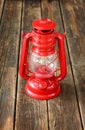 Red vintage lamp on wooden table. copy space. Royalty Free Stock Photo