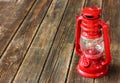 Red vintage lamp on wooden table. copy space. Royalty Free Stock Photo