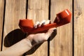Red vintage phone handset in a woman`s hand. Royalty Free Stock Photo