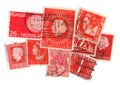 Red vintage postage stamps from the Netherlands. Royalty Free Stock Photo