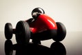 Red vintage racing tiny car backwards on a studio shot Royalty Free Stock Photo