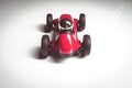 Red vintage racing tiny car backwards on a studio shot Royalty Free Stock Photo